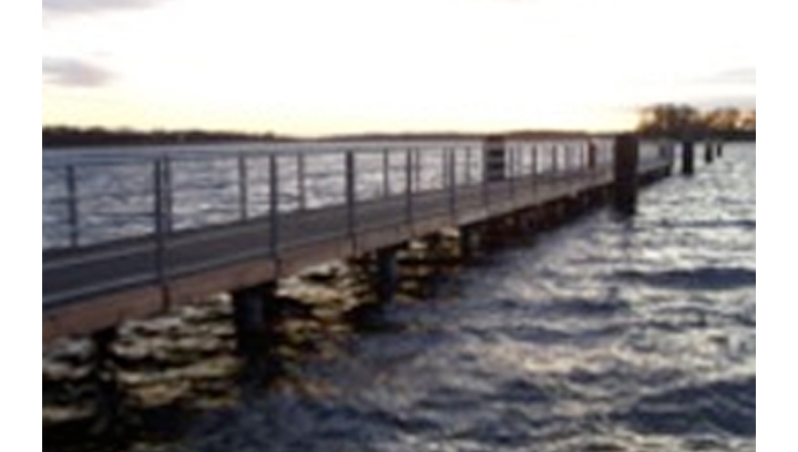 Completed jetty using composite piles and grooved no-slip decking